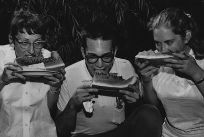 Three students eating watermelon at the Watermelon Feast.  Photographer: Herald-Leader