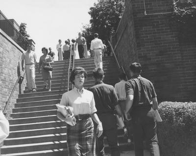Students walking up and down stairs across from Funkhouser Building, between classes. Received June 1, 1962 from Public Relations