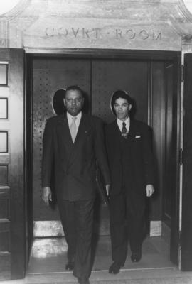 Lyman Johnson, right, and Kentucky State University President R. B. Atwood, leave federal district court in Lexington, after the court ruled in favor of Johnson's admission to the University of Kentucky