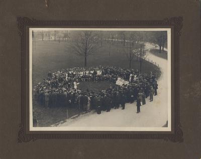 Arbor Day Exercises--Arbor Day is a tradition where every year the senior class assembles and has a ceremony and plants a tree. This photo appears on page 73 in the 1915 