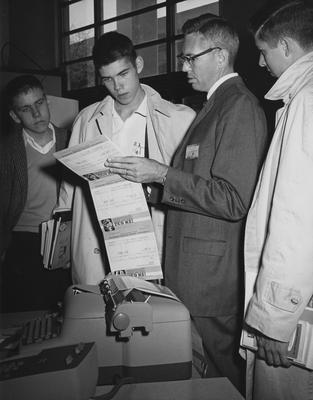 Men showing UK students about IBM 632 at the 1960 Career Carnival. Received November 1, 1960 from Public Relations