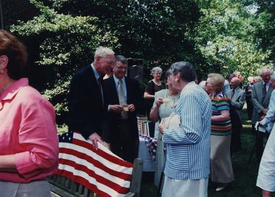 Celebration: July 11, 2002; Actual Birthday: July 16, 2002. Left to right: unidentified man, Bill and Jan Marshall, both holding punch cups, and Dr. Mary W. Hargreaves in a striped suit