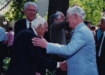 Celebration: July 11, 2002; Actual Birthday: July 14, 1903. Charles Shearer, President of Transylvania, George Herring, UK Professor of history in the center, and Dr. Clark is shaking hands with former UK President Frank Dickey