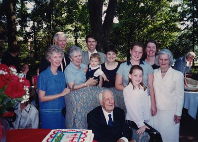 Celebration: July 11, 2002; Actual Birthday: July 14, 1903. Dr. Thomas D. Clark seated, his daughter , Elizabeth with her hand on the chair, his son Bennett Clark is behind her, and Dr. Clark's wife, Loretta is standing in the front