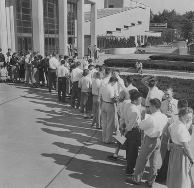 Registration--students waiting in a line outside of Memorial Coliseum to register for classes. Mack Hughes photograph