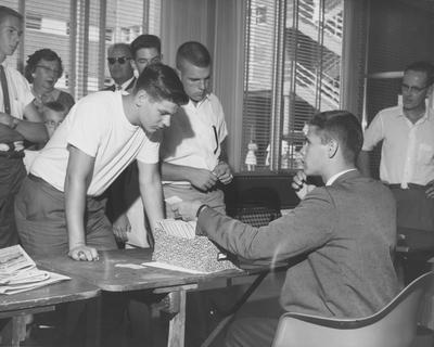 Registration--Freshman registration in the dorms. Photo appears first on page 27 in the 1962 