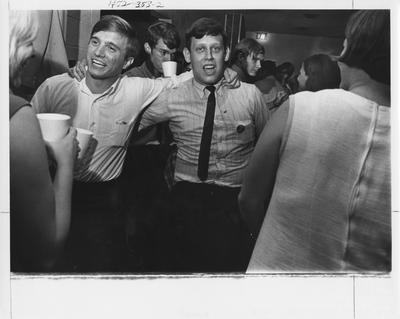 Students enjoying fraternity life. This photo appears second on page 353 in the 1969 Kentuckian