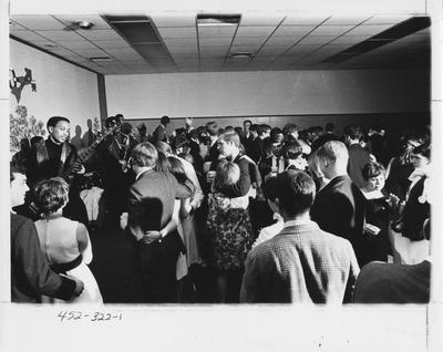 Students enjoy a fraternity sponsored dance. This photo appears first on page 322 in the 1969 Kentuckian