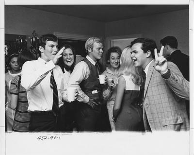 Students socialize at a fraternity party. This photo appears first on page 90 in the 1969 Kentuckian