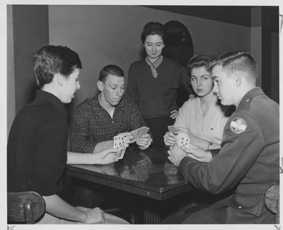 Four people playing a card game; second from right is Dale Primrose