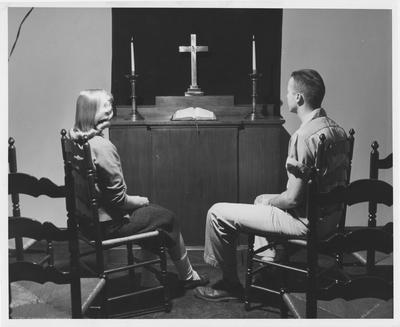Carol Yates (left) and Grady Sellars (right) are in the Student Union Building Chapel. Received May 22, 1958 from Public Relations