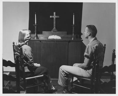 Carol Yates (left) and Grady Sellars (right) are in the Student Union Building Chapel. Received May 22, 1958 from Public Relations