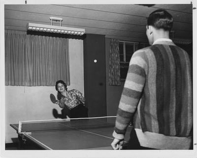 Barbara Zweifel (left) and Steve Clark (right) are playing table tennis