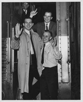Three men waving from train. Herald-Leader photo. Received January 19, 1961 from Public Relations