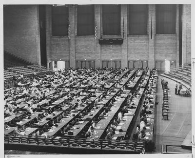 Many students in Memorial Coliseum taking the Graduate Records Exams. Received March 16, 1962 from Public Relations