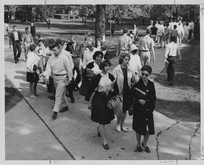 Students walking between classes. Fourth girl from the right, facing the camera, is Mary Lou Veal