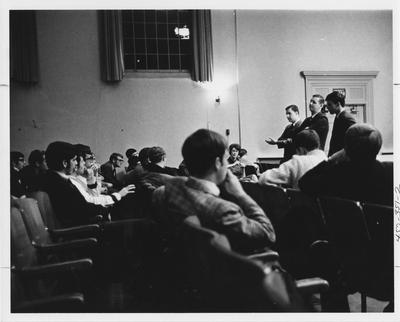 Inter Fraternal Counsel having a discussion. This image appears second on page 351 in the 1969 Kentuckian