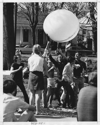 Unidentified students are tossing around a big balloon on Teen Angel Day. This photo appears first on page 118 in the 1969 Kentuckian