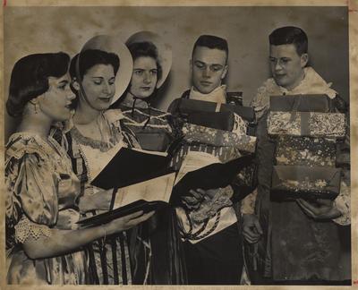 Five students singing at the Hanging of the Greens. Lexington Herald-Leader staff photo. Received December 14, 1959 from Public Relations