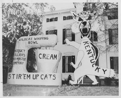 Wildcat Whipping Bowl--Stir 'em up cats!; first place Homecoming decorations. Sigma Alpha Epsilon winner. Photographer: Glen Thomasson. Received August 17, 1957 from Public Relations. This image appears second on page 208 in the 1957 Kentuckian