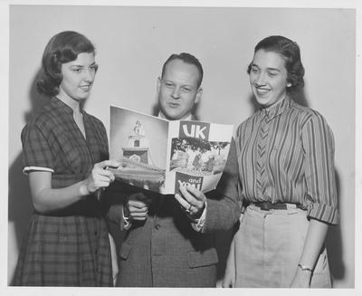 James Beazley (center) and Carolyn Collier (right) looking at 