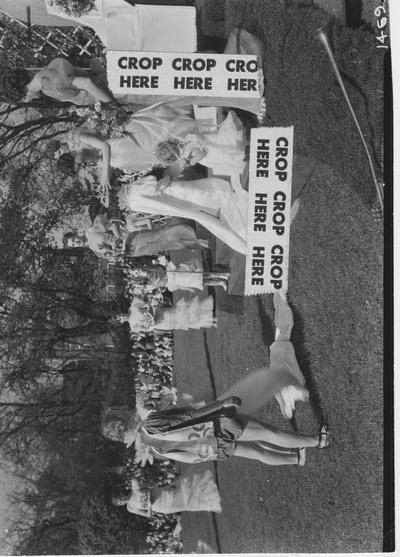 The crowning of the May Day Queen at the annual May Day Celebration. This image appears second on page 40 in the 1965 Kentuckian