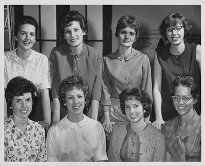 Eight unidentified female members of the honorary society the Dames Club. Lexington Herald-Leader staff photo