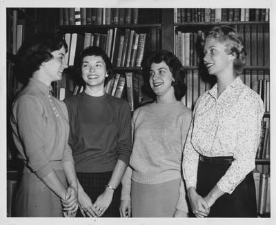 From left to right: Janis Gover, Gay Evens, Evelyn Steele, Laura Weinman. Received October 21, 1958 from Public Relations