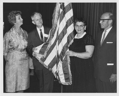 Officials at Girls State Conference. From left to right: Doris Seward, Dean of Women; Dr. Reeves, professor in science; unidentified woman, and unidentified man. Photographer: Lexington Herald-Leader