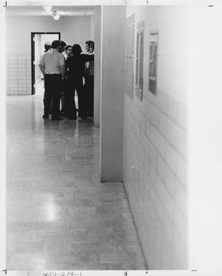 Students for Action and Responsibility members talking in a hallway; This photo is in the 1969 Kentuckian on page 239, picture number 1