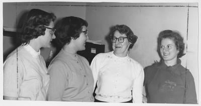 Four unidentified women of the Young Women's Christian Association