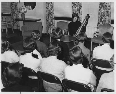 Jane Marvin Brock (Miss Kentucky 1957) at Folk Festival holding a dulcimer instrument