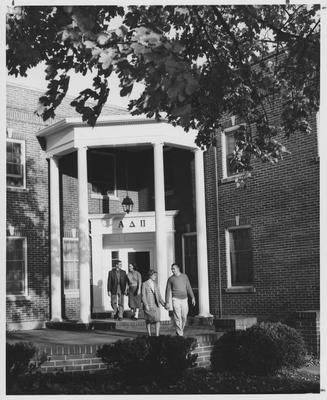 Couples leaving the Alpha Delta Pi sorority house; Boy in front is Jim Baughman