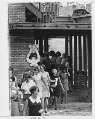 Alpha Chi Omega sisters taking a tour of their new house; This image is in the 1969 Kentuckian on page 300, image 1