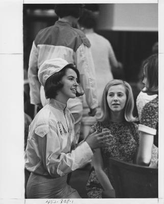 Chi Omega sisters chat; This image is in the 1969 Kentuckian on page 308, image 1
