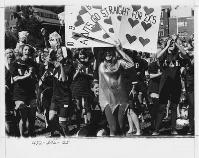 Alpha Delta Pi sisters cheering for Sigma Chi; This photo is in the 1969 Kentuckian on page 302