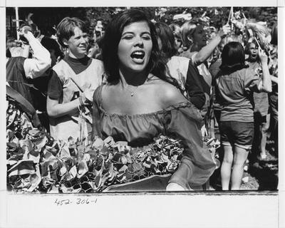 Alpha Xi Delta sister during a parade; This image is in the 1969 Kentuckian on page 306, image 1