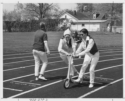 Sorority sisters in a scooter relay; This photo is in the 1969 Kentuckian on page 278, picture number 2