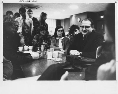 Fred Halstead, the presidential candidate of the Socialist Workers Party, speaks to a group of students; Halstead was brought to the University of Kentucky by the Faculty Senate; This photo is in the 1969 Kentuckian on page 60, picture number 1