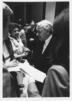 Scotty Reston (center) talk to people at the 1979 Creason Lectures