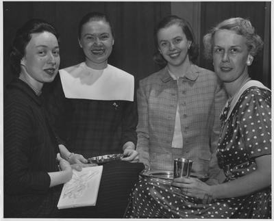 Four women seated, with gifts; Left to right: unidentified, Joy Bell, unidentified, Margaret Bruce Cruise; Lexington Herald - Leader staff photo