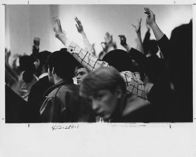 Students raise their hands during a protest; This image is in the 1969 Kentuckian on page 280, image 1