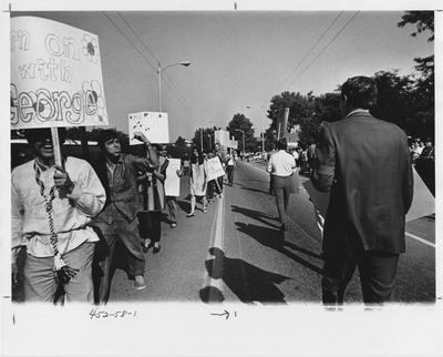 Wallace supporters and opponents march on Euclid Ave; This image is in the 1969 Kentuckian on page 58, image 1