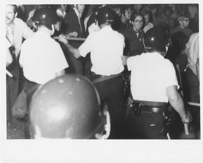 Police hold back protesters during the reaction to the Kent State shootings