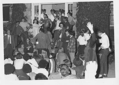 Police officers guarding front doors of Administration Building during student protest of the Kent State shootings