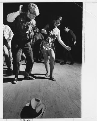 Students in costume dance at a Sadie Hawkins Dance sponsered by the Student Center Board; This photo is in the 1969 Kentuckian on page 82, image number 1