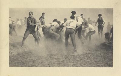 Men in a tug-of-war between the Freshmen and Sophomores at Clifton Pond; The 