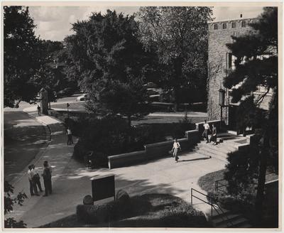 Students walking near the Student Union Building at the old main entrance to campus
