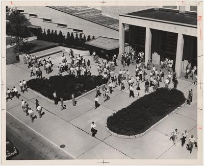 Students milling about in front of Memorial Coliseum; Photographer: John Mitchell