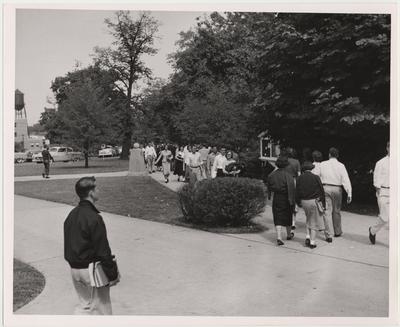 James Cloud (left, foreground) walks with other students to and from classes